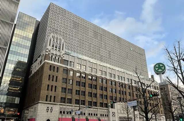 The Daimaru Shinsaibashi main building in Osaka, a brick and stone department store with a patterned upper facade