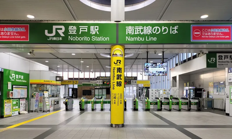 The JR ticket gates at Noborito Station, under green signs reading Noborito Station and Nambu Line
