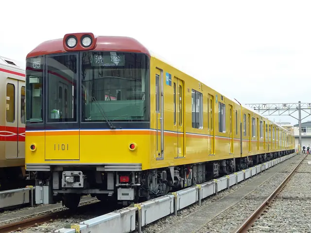 Photo: PekePON (CC BY-SA 4.0) A yellow Ginza Line 1000-series train at a depot